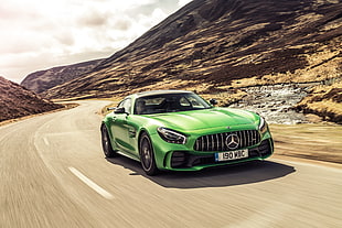 time lapse photography of green Mercedes-Benz sports car on gray asphalt road