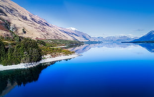 panoramic photo of building near sea during daytie, glenorchy HD wallpaper