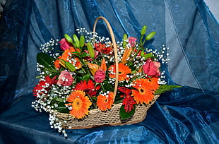 bouquet of orange, red, and pink flowers