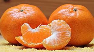 close up photography of two orange fruits HD wallpaper