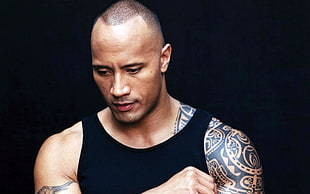 The Rock wearing black tank top