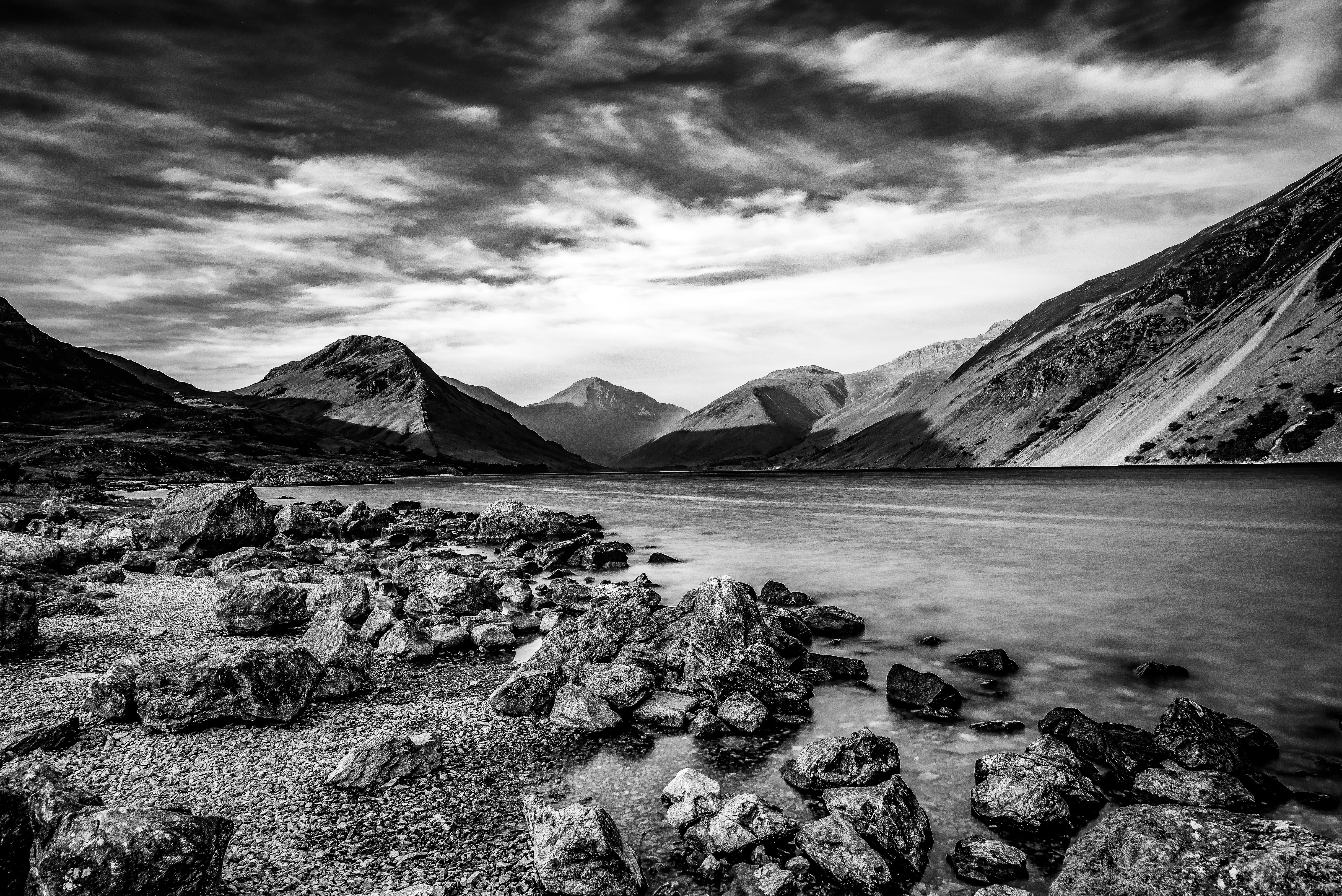 Grayscale photo of mountain beside body of water HD ...