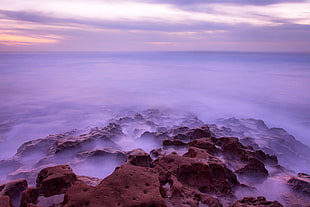 body of water photography during day time
