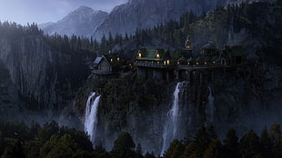 waterfalls beside castle near mountain