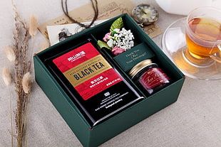 Black Tea pack with box on white surface