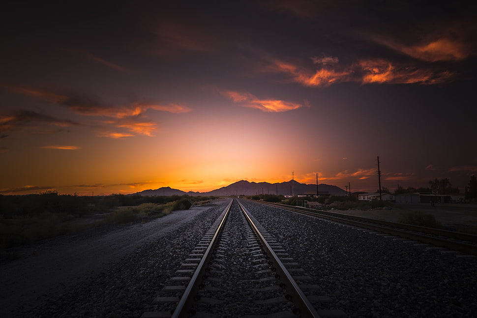 grey metal train rail during dawn HD wallpaper