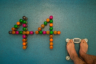 human on glass bathroom weighing scale at 141.32 HD wallpaper