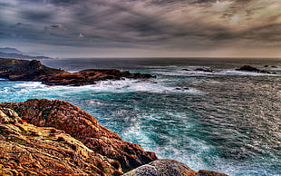 brown rock formations, sea, HDR