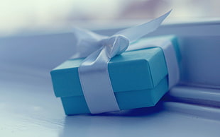 blue gift box selective focus photography