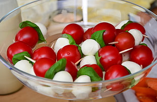 cherry tomatoes in clear glass bowl