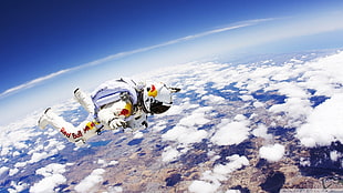 white and yellow astronaut suit, skydiving
