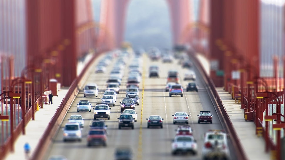 selective focus photography of vehicles on bridge at daytime HD wallpaper
