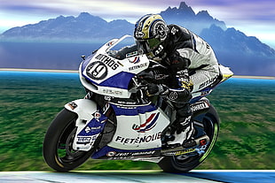 man riding white and blue sports motorcycle
