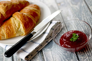 bread knife on white plate beside bread and ketchup HD wallpaper