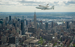 space shuttle and white airplane, cityscape, city, space shuttle, NASA HD wallpaper