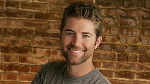man in gray crew-neck shirt smiling HD wallpaper