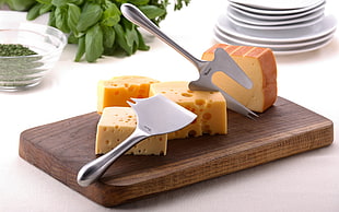 cheese on brown wooden chopping board