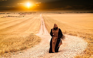 brown and black coat, monks, ground, path, road