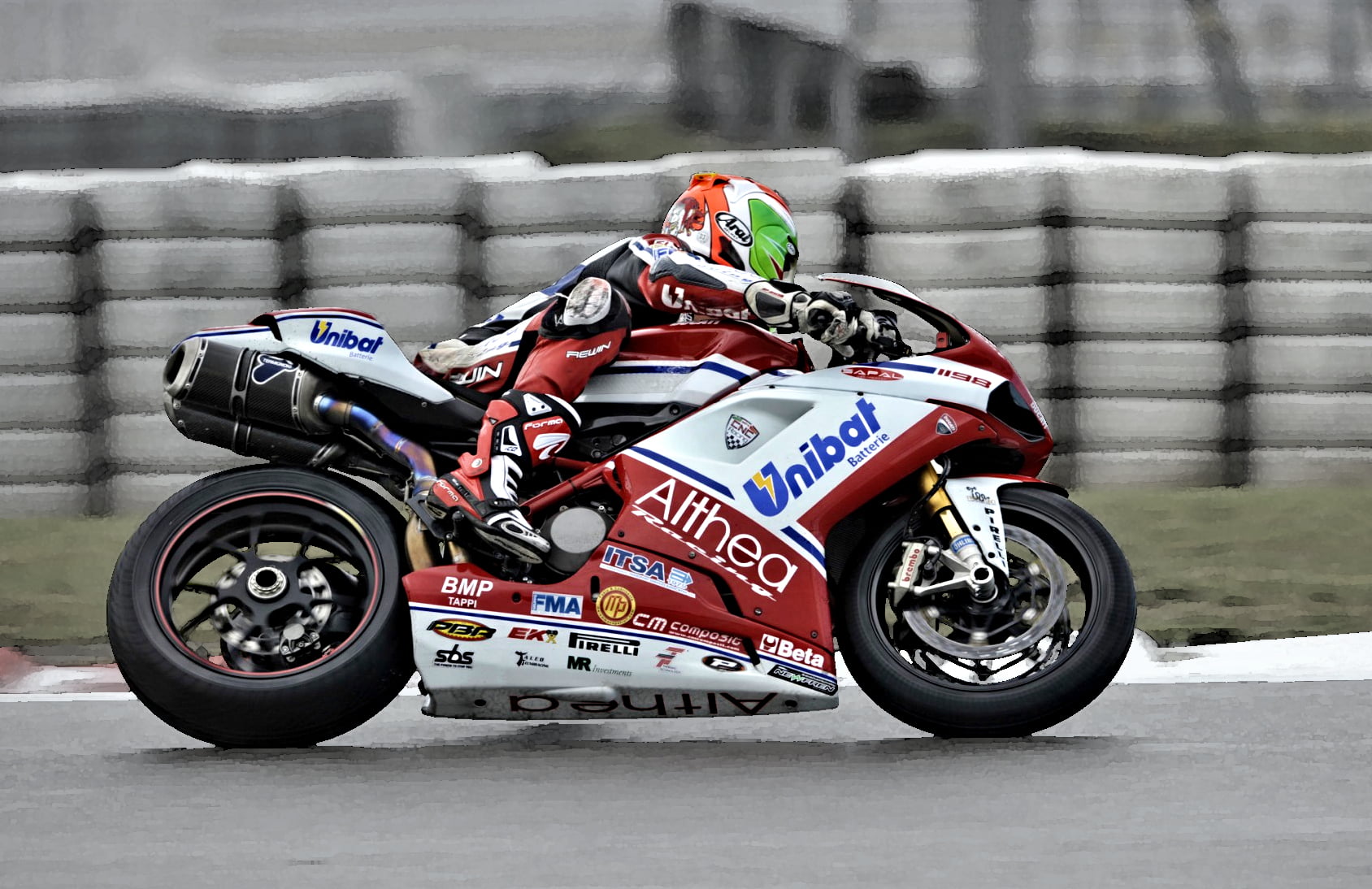 man in racer suit riding on red and white sports bike