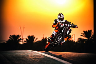 person riding motorcycle on road HD wallpaper