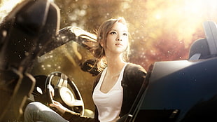 woman wears white tank top sitting inside car