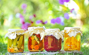 four pickle fruit jars