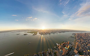 aerial photography of city buildings with sun rise background
