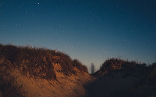 person standing between hills, photography, stars, dune, ghosts HD wallpaper