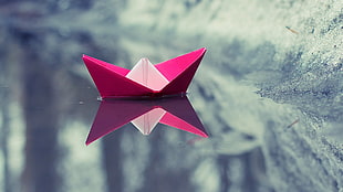 pink paper boat in water HD wallpaper