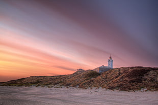 tower across the sand field HD wallpaper