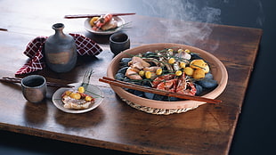 oriental vegetable with shrimp on table with tea set on wooden table