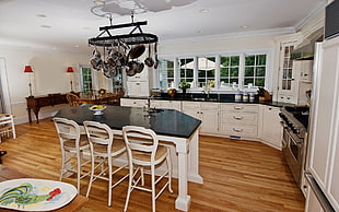 white wooden frame black top-glass kitchen island