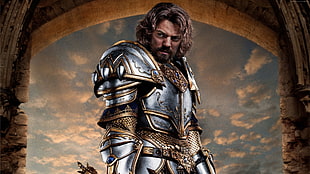 man in grey and brown knight armor standing behind arc gate