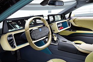 beige and black multifunction vehicle steering wheel