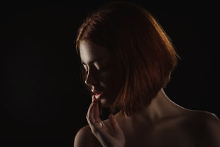 photography of side view of a woman with brown short hair