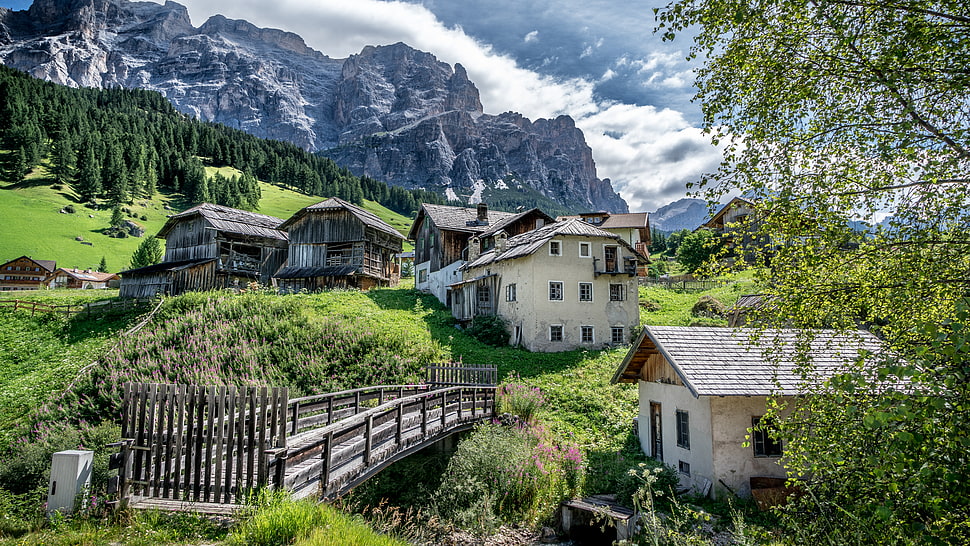 woooden bridge closed across houses, san cassiano, alta badia, italy HD wallpaper