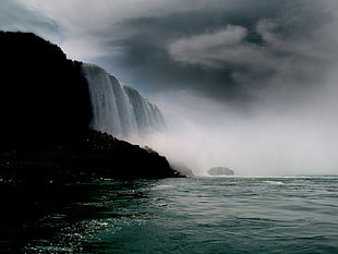 waterfalls during cloudy day