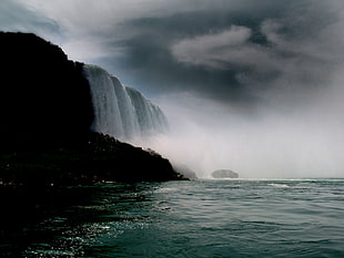 waterfalls during cloudy day HD wallpaper