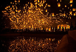 silhouette photo of sky lanterns