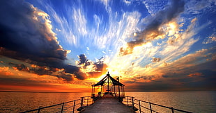 dock with roof on body of water, landscape, sky, sea, sunset