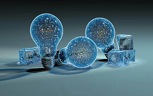 three glittered LED bulbs