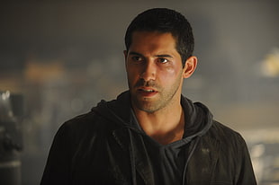 closeup photograph of man in black hoodie jacket HD wallpaper