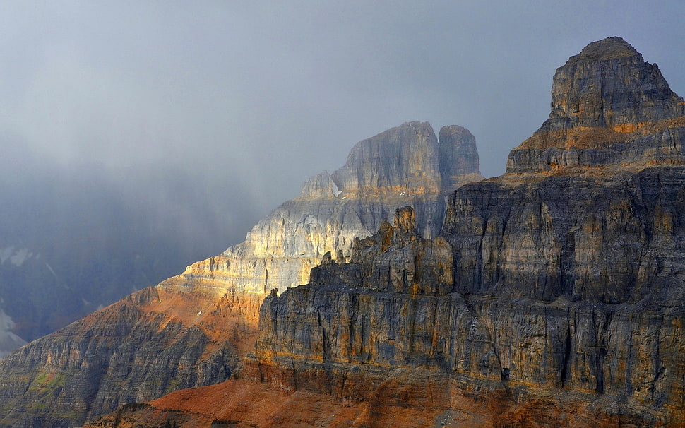 gray cliff with gray clouds HD wallpaper