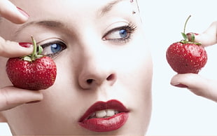 woman holding strawberries