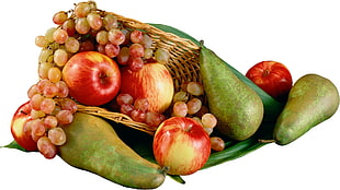 purple grapes and apple on basket