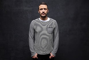 man wearing black and white stripe long-sleeved shirt