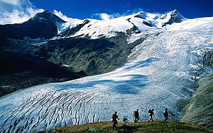 people trekking on mountain HD wallpaper