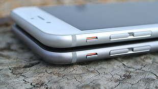 shallow focus photography of two silver iPhone 6