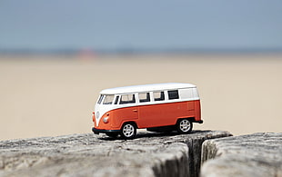 selective focus photography of orange and white bus