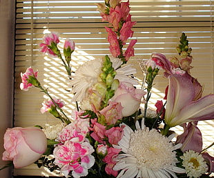 pink and white petaled flower arrangement